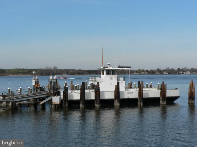 102 Jacks Point Road Oxford, MD 21654 - Photo 78 of 83 a view of a ocean with boats and trees in the background
