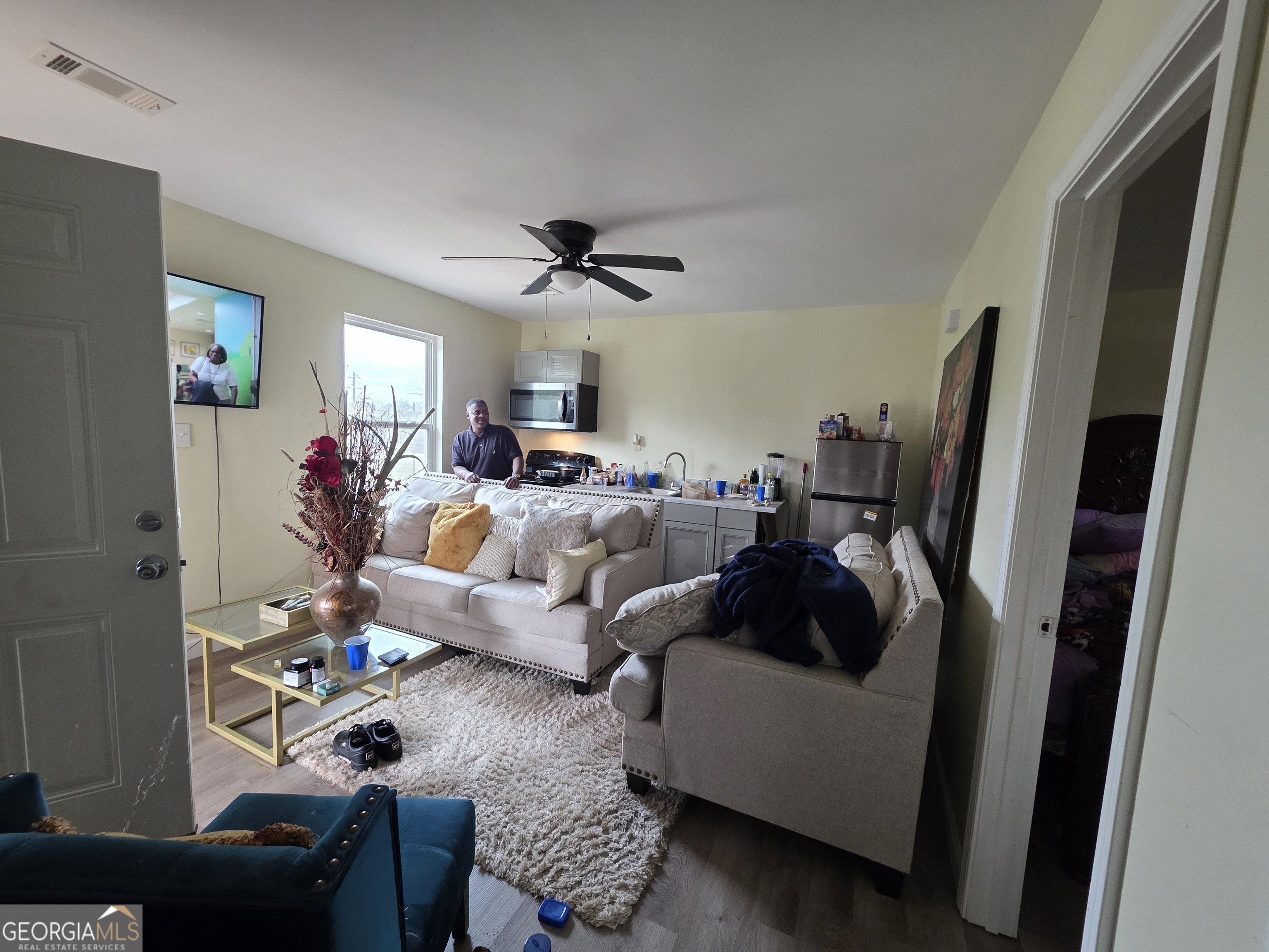 403 Vienna Street Fort Valley, GA 31030 - Photo 4 of 10 a living room with furniture and a flat screen tv