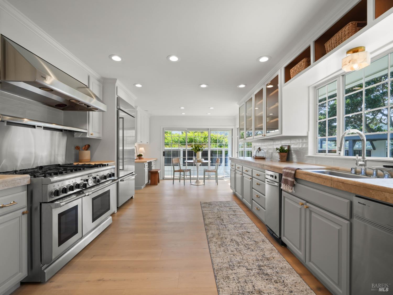 148 Dominican Drive San Rafael, CA 94901 - Photo 18 of 60 a large kitchen with stainless steel appliances granite countertop a stove and a sink