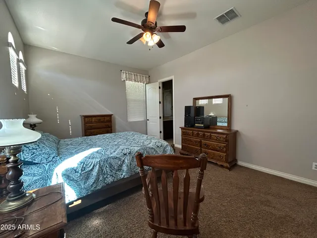a bathroom with a double vanity sink a mirror and a bathtub