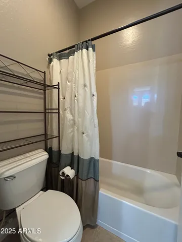 a bedroom with a bed and a closet