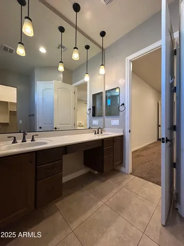 a view of a porch with furniture and a yard