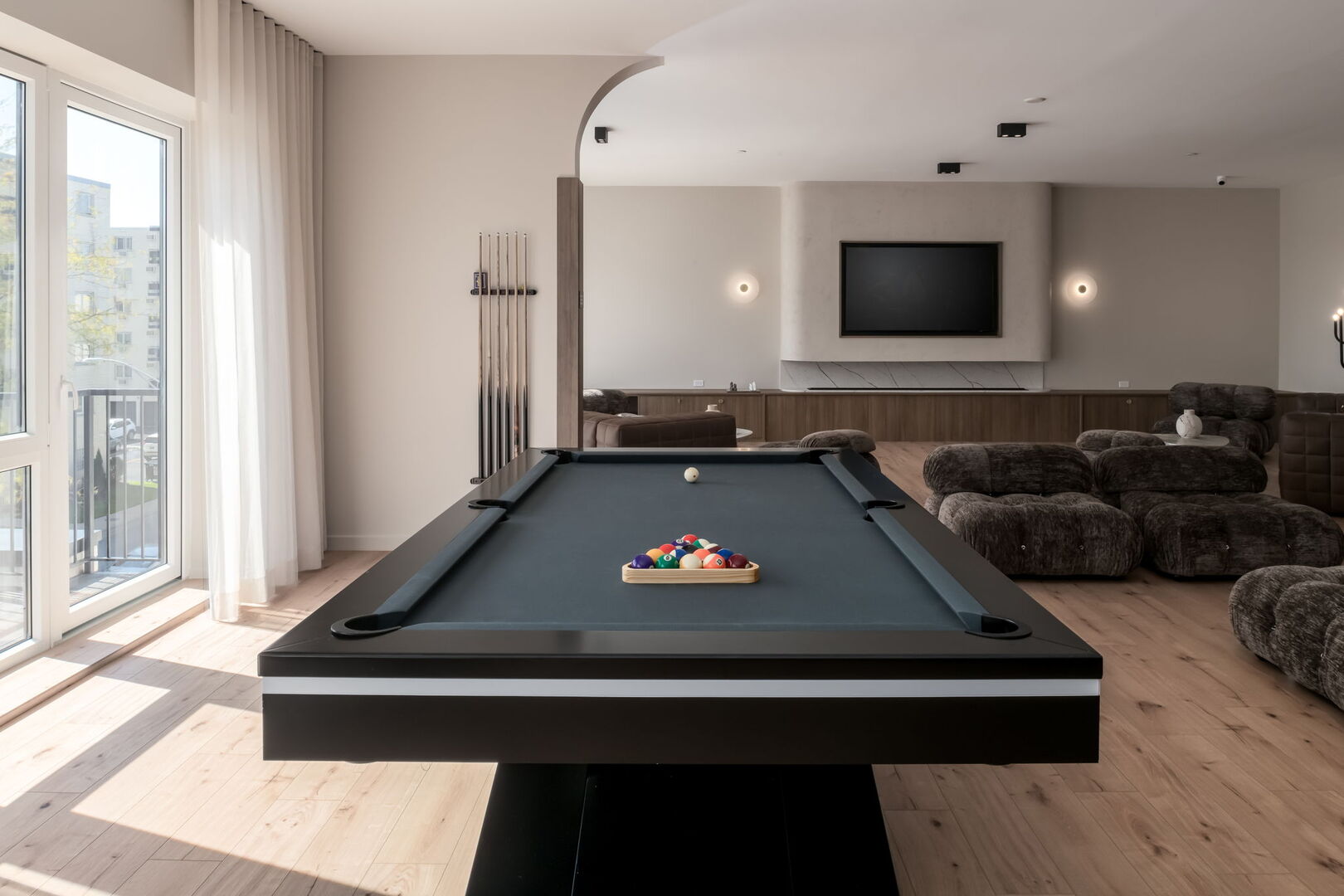 8000 O Connor Drive, Unit 301 River Grove, IL 60171 - Photo 42 of 52 a living room with furniture pool table and a flat screen tv