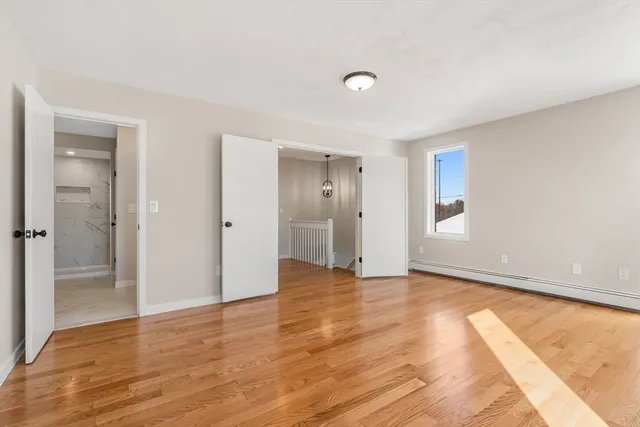 a view of an empty room and window
