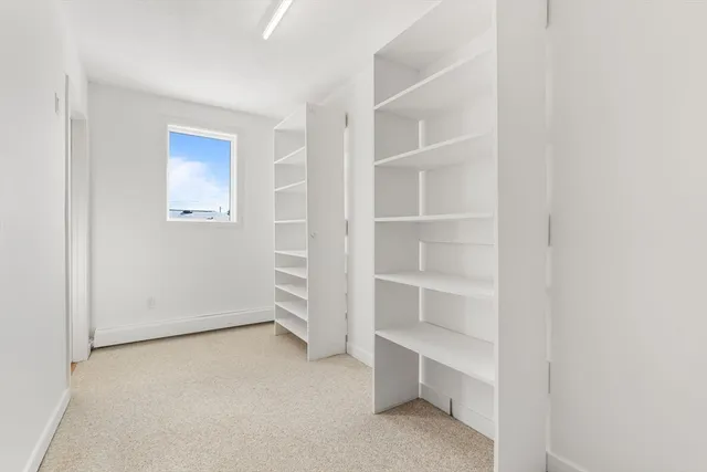 a view of an empty room with empty racks