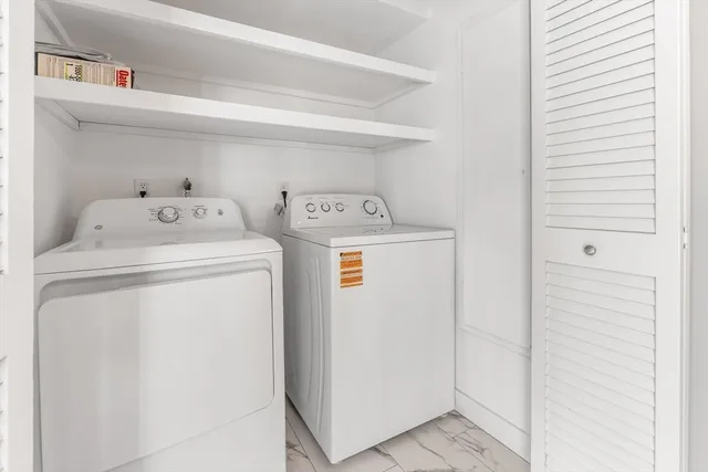 a utility room with dryer and washer