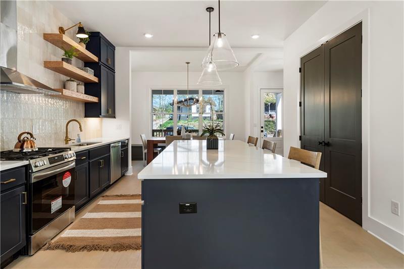 1901 Browns Mill Road Southeast Atlanta, GA 30315 - Photo 14 of 42 a kitchen with stainless steel appliances granite countertop a sink a stove and a refrigerator