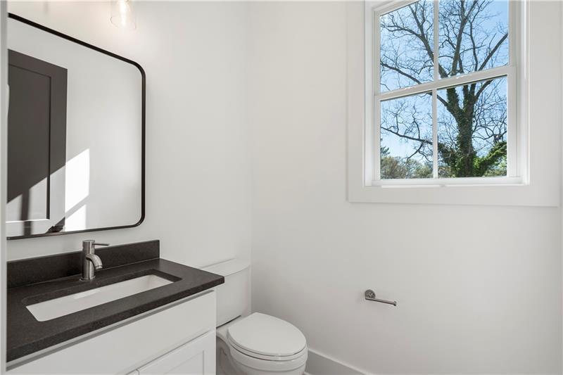 1901 Browns Mill Road Southeast Atlanta, GA 30315 - Photo 19 of 42 a bathroom with a toilet sink and mirror
