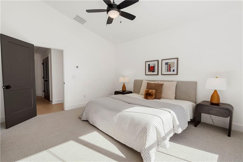 1901 Browns Mill Road Southeast Atlanta, GA 30315 - Photo 22 of 42 a bedroom with a bed and a chandelier