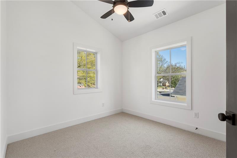 1901 Browns Mill Road Southeast Atlanta, GA 30315 - Photo 27 of 42 an empty room with a window and a ceiling fan