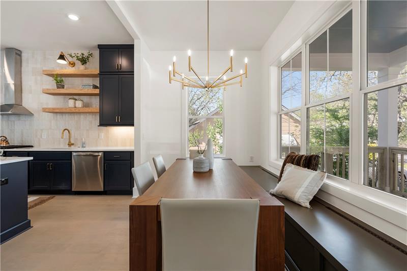 1901 Browns Mill Road Southeast Atlanta, GA 30315 - Photo 7 of 42 a view of kitchen with stainless steel appliances granite countertop sink stove and wooden floor