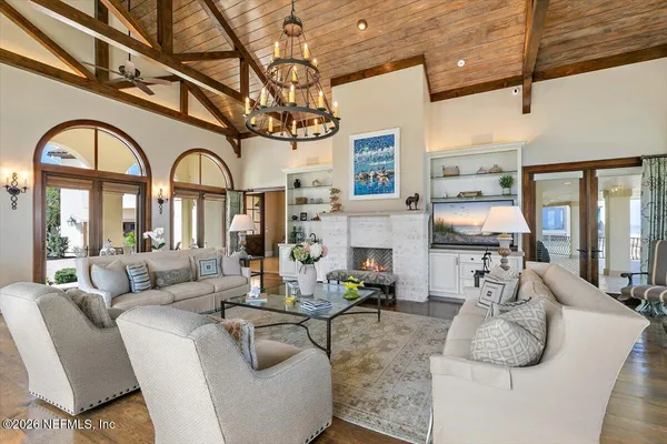 a view of a large living room with large windows