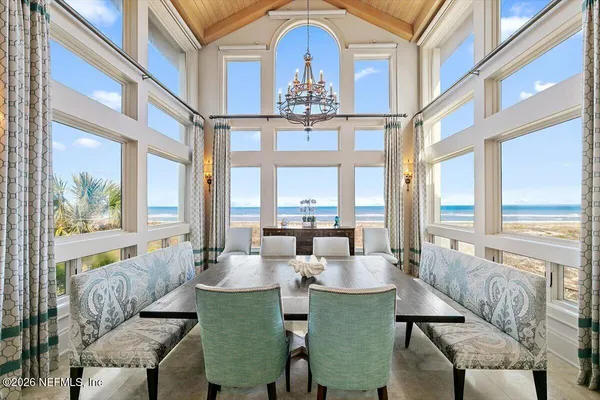 a dining room with furniture and wooden floor