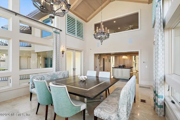 a bathroom with double vanity sinks a mirror and a shower
