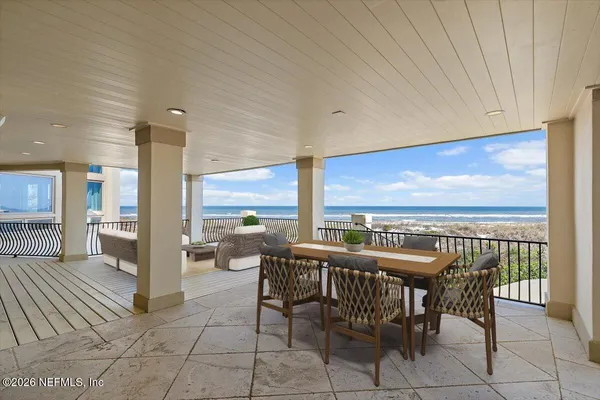 a kitchen with white cabinets and sink