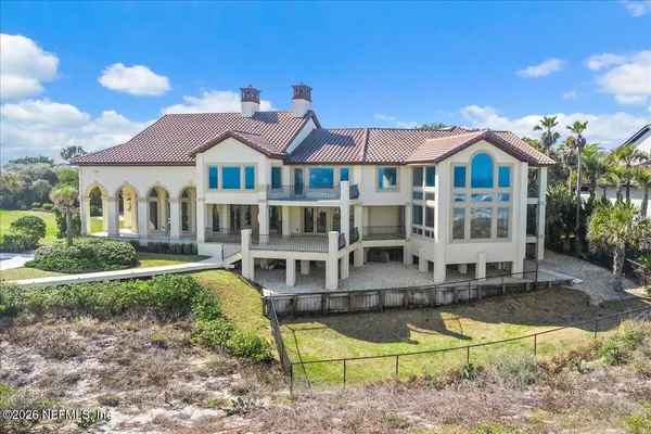a view of room with wooden floor and fan