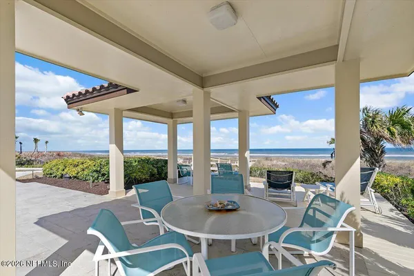 an aerial view of a house with a swimming pool