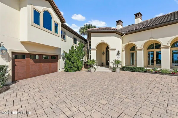 a kitchen with cabinets and window