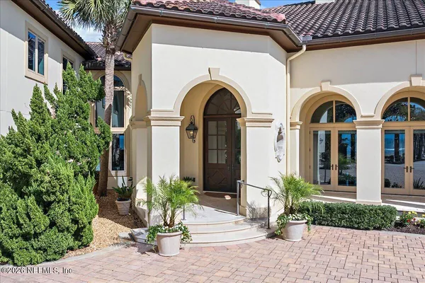 a living room with furniture fireplace and a table