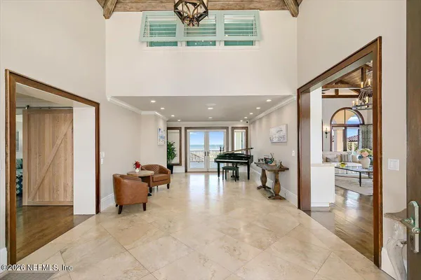 a kitchen with stainless steel appliances granite countertop table chairs stove and cabinets