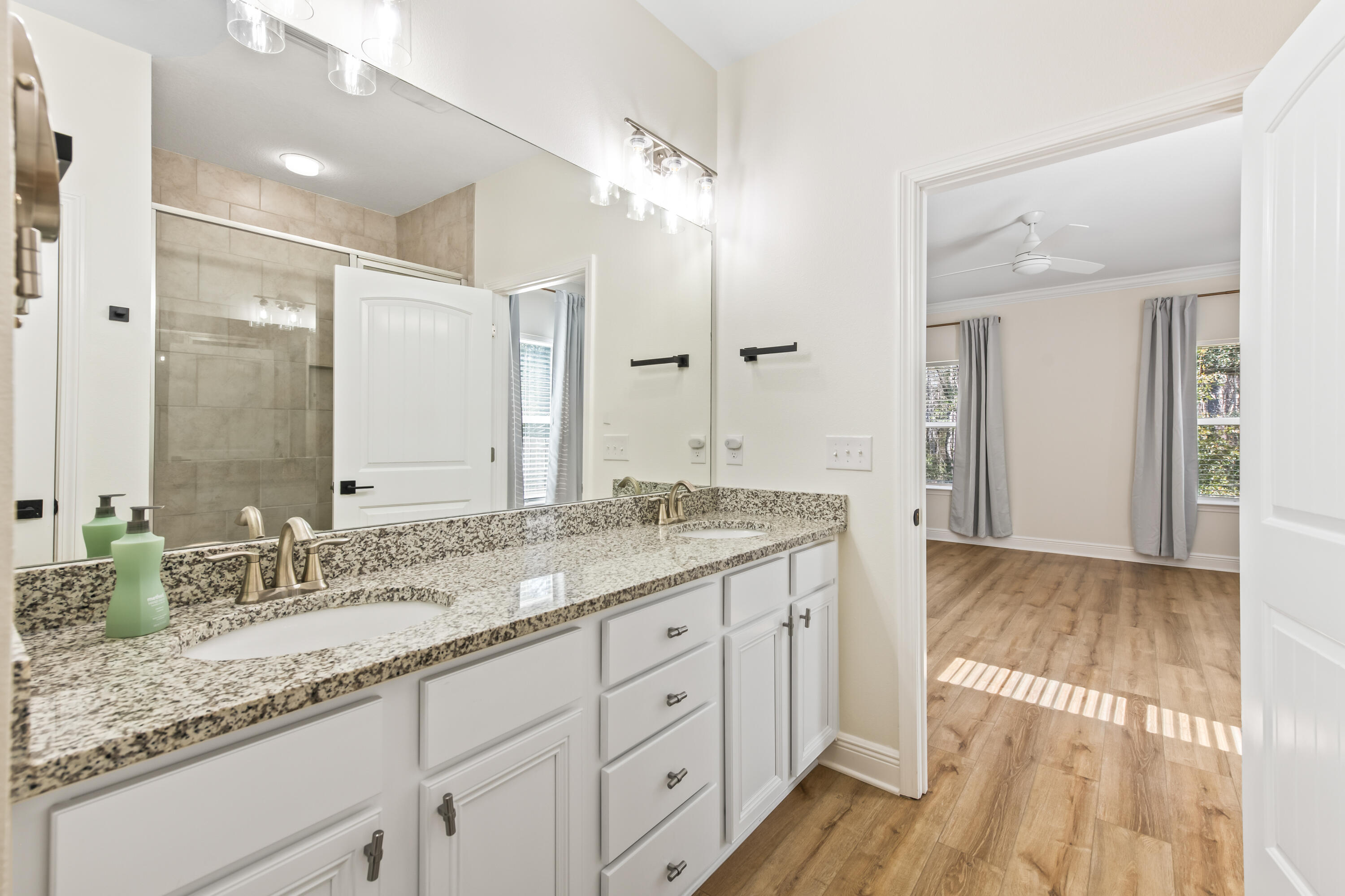 369 Wayne Trail Santa Rosa Beach, FL 32459 - Photo 21 of 47 a bathroom with a granite countertop double vanity sink and mirror