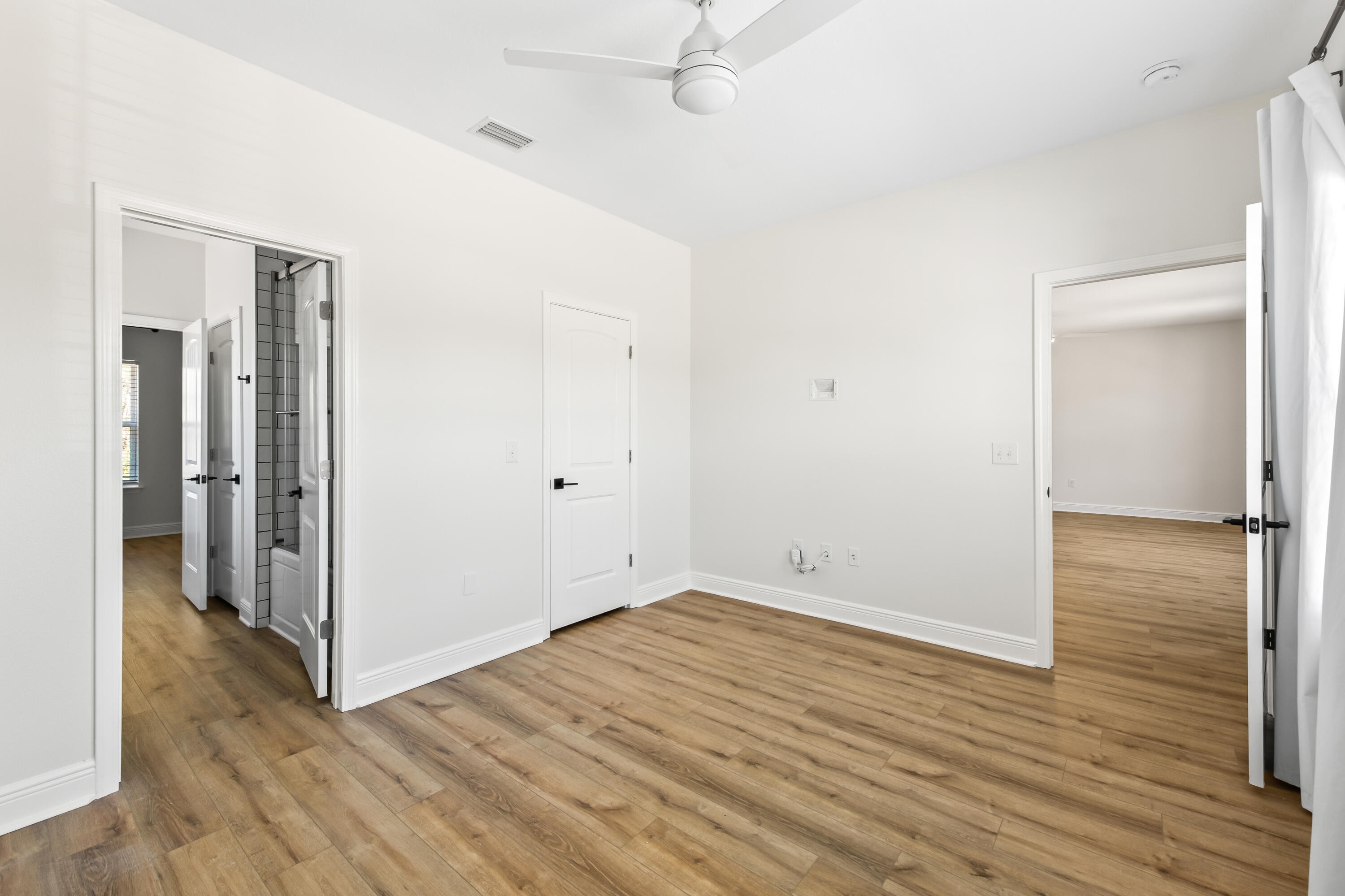 369 Wayne Trail Santa Rosa Beach, FL 32459 - Photo 28 of 47 a view of an empty room with wooden floor