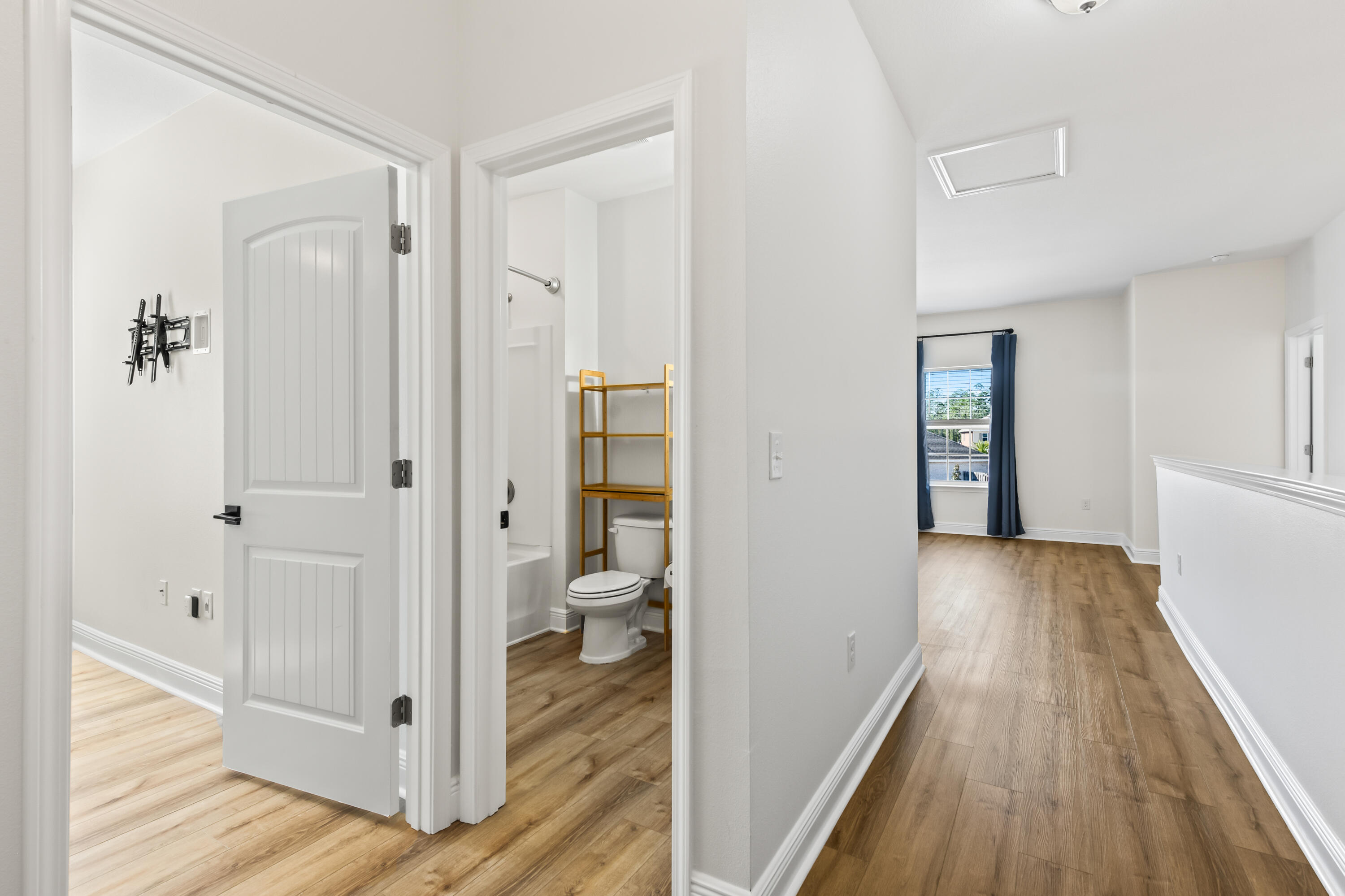 369 Wayne Trail Santa Rosa Beach, FL 32459 - Photo 33 of 47 a view of a hallway with wooden floor and closet area