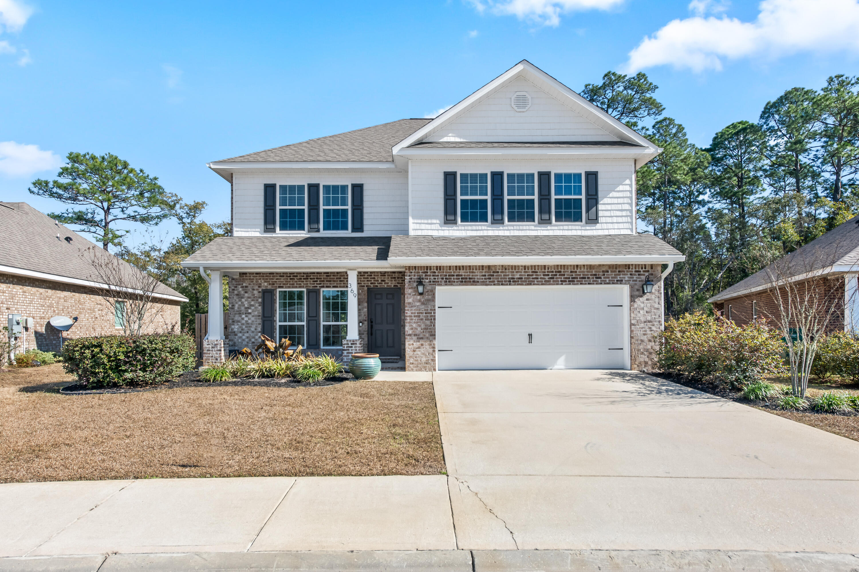 369 Wayne Trail Santa Rosa Beach, FL 32459 - Photo 45 of 47 a front view of a house with porch
