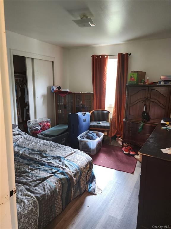 808-812 State Rt 17B Monticello, NY 12701 - Photo 25 of 35 Bedroom with wood-type flooring, a closet, and ceiling fan
