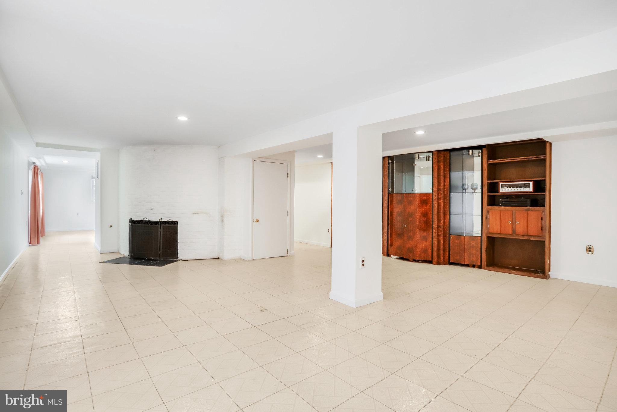 6105 Colchester Road Fairfax, VA 22030 - Photo 57 of 57 Rec room with plenty of light and gas fireplace