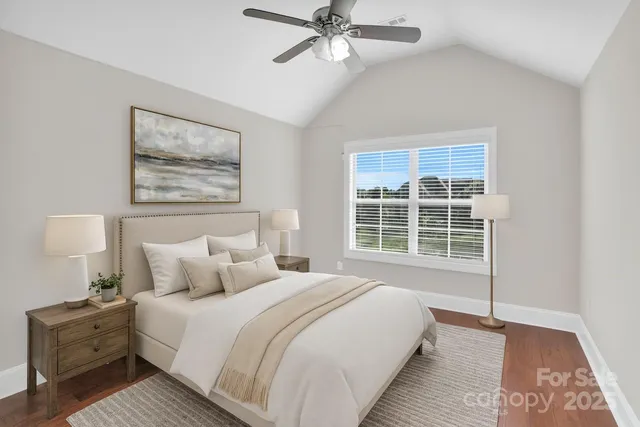 a bathroom with a granite countertop sink a toilet and a mirror