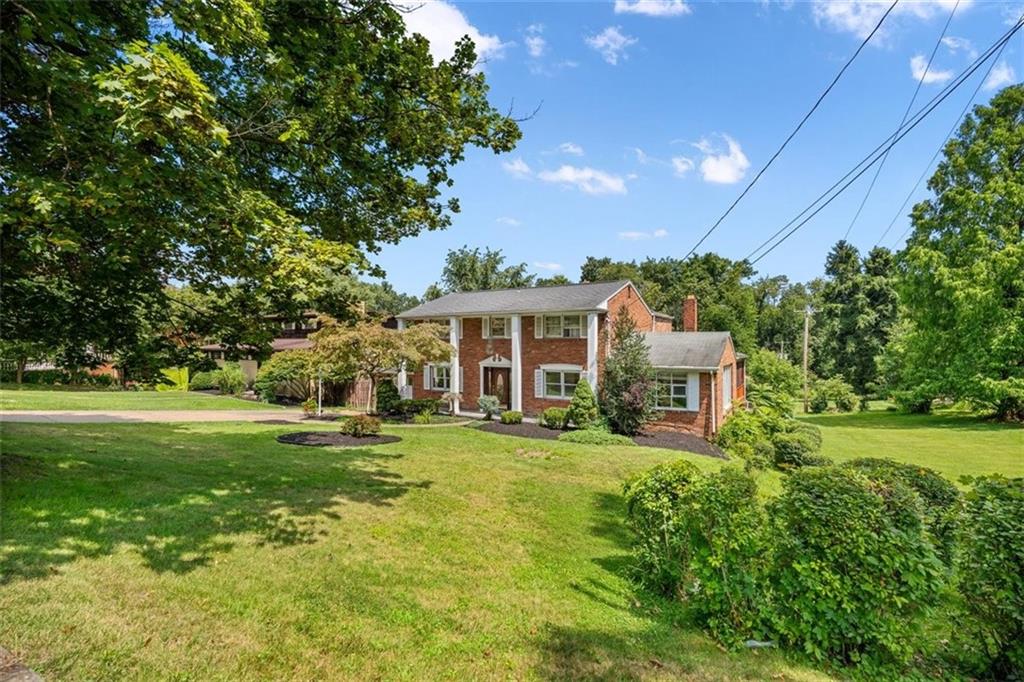 4 Dendron Drive Coraopolis, PA 15108 - Photo 3 of 36 a front view of a house with a yard table and chairs