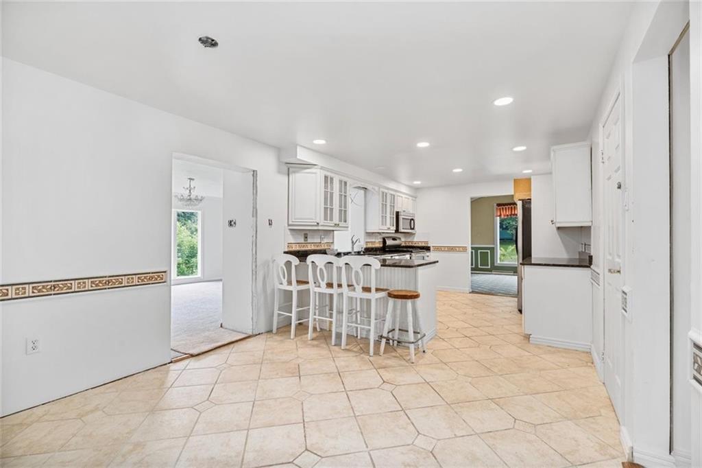 4 Dendron Drive Coraopolis, PA 15108 - Photo 10 of 36 a view of kitchen with stainless steel appliances kitchen island refrigerator and chairs