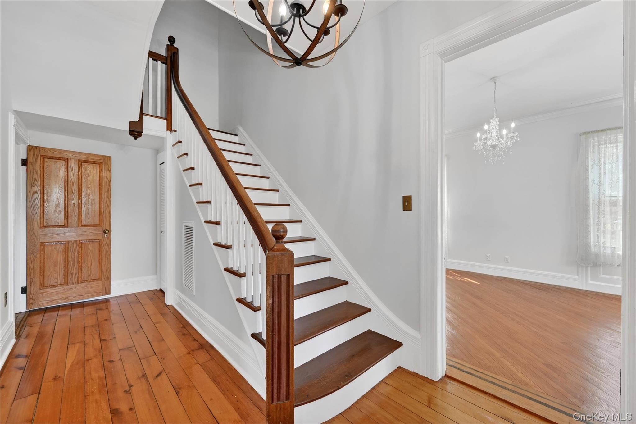 12 Perry Creek Road Washingtonville, NY 10992 - Photo 4 of 48 a view of a hallway with wooden floor and staircase