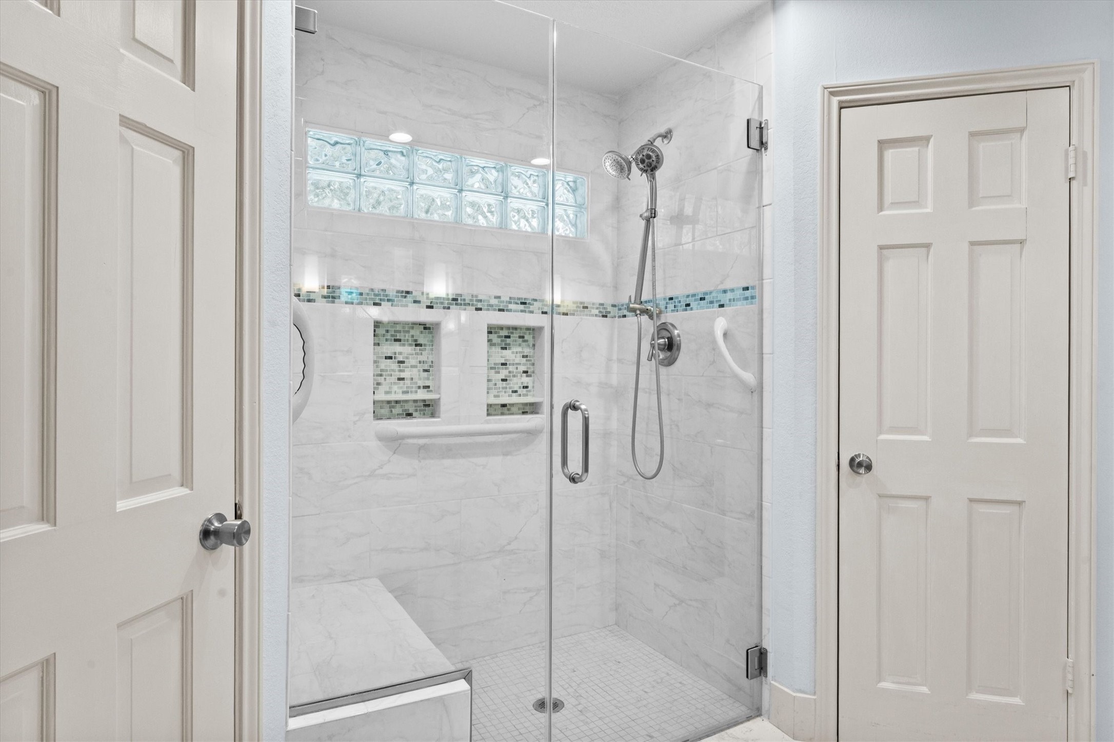 25319 Old Carriage Lane Spring, TX 77373 - Photo 23 of 35 a bathroom with a glass shower door