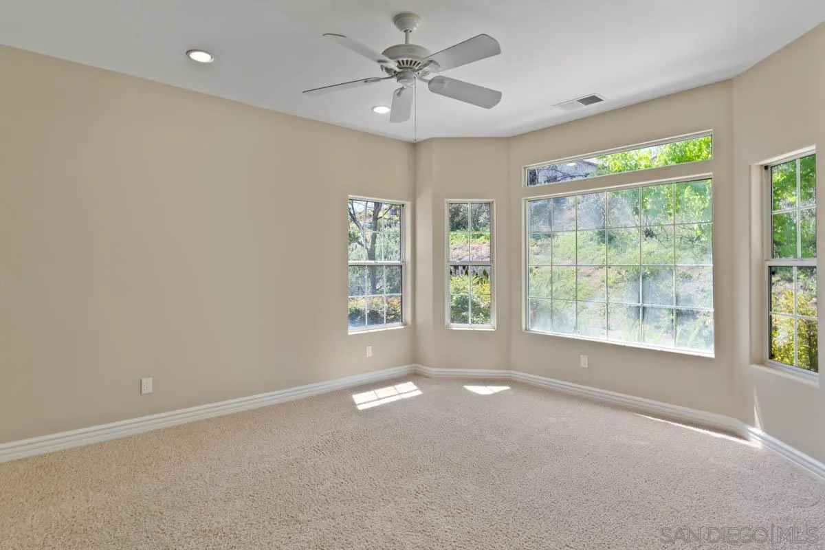 544 Alpine Trail Road Alpine, CA 91901 - Photo 18 of 52 a view of a livingroom with a ceiling fan and window