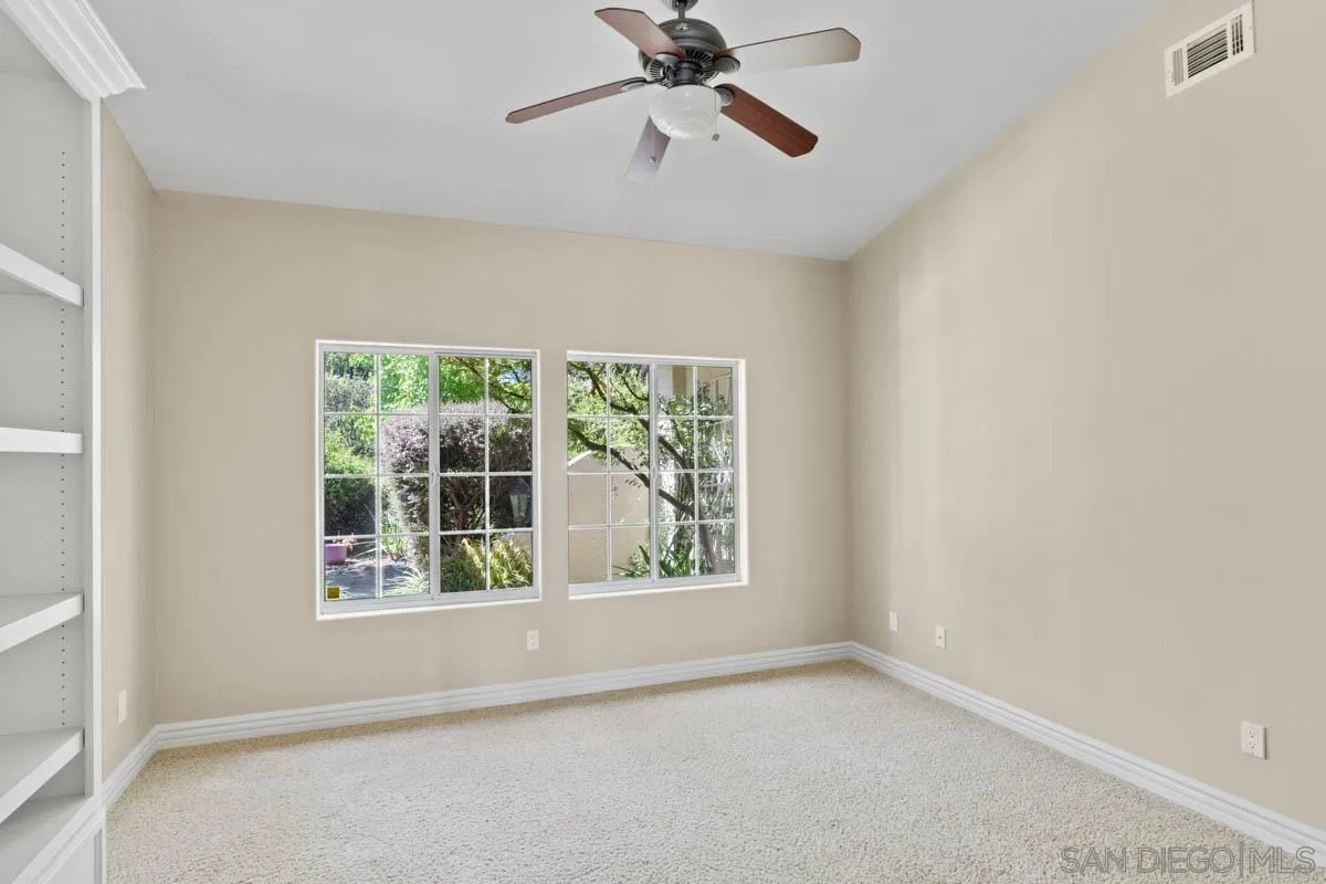 544 Alpine Trail Road Alpine, CA 91901 - Photo 24 of 52 an empty room with a window and a ceiling fan