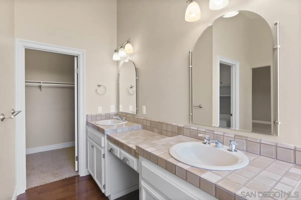 544 Alpine Trail Road Alpine, CA 91901 - Photo 29 of 52 a bathroom with a granite countertop sink and a mirror