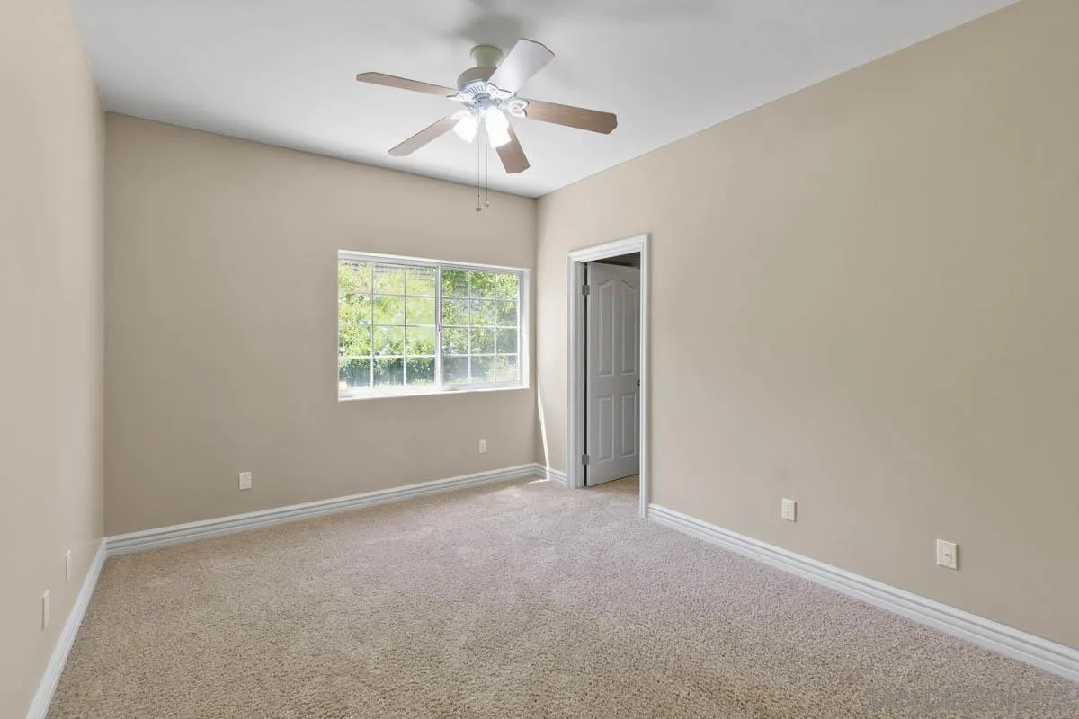 544 Alpine Trail Road Alpine, CA 91901 - Photo 33 of 52 an empty room with windows and fan