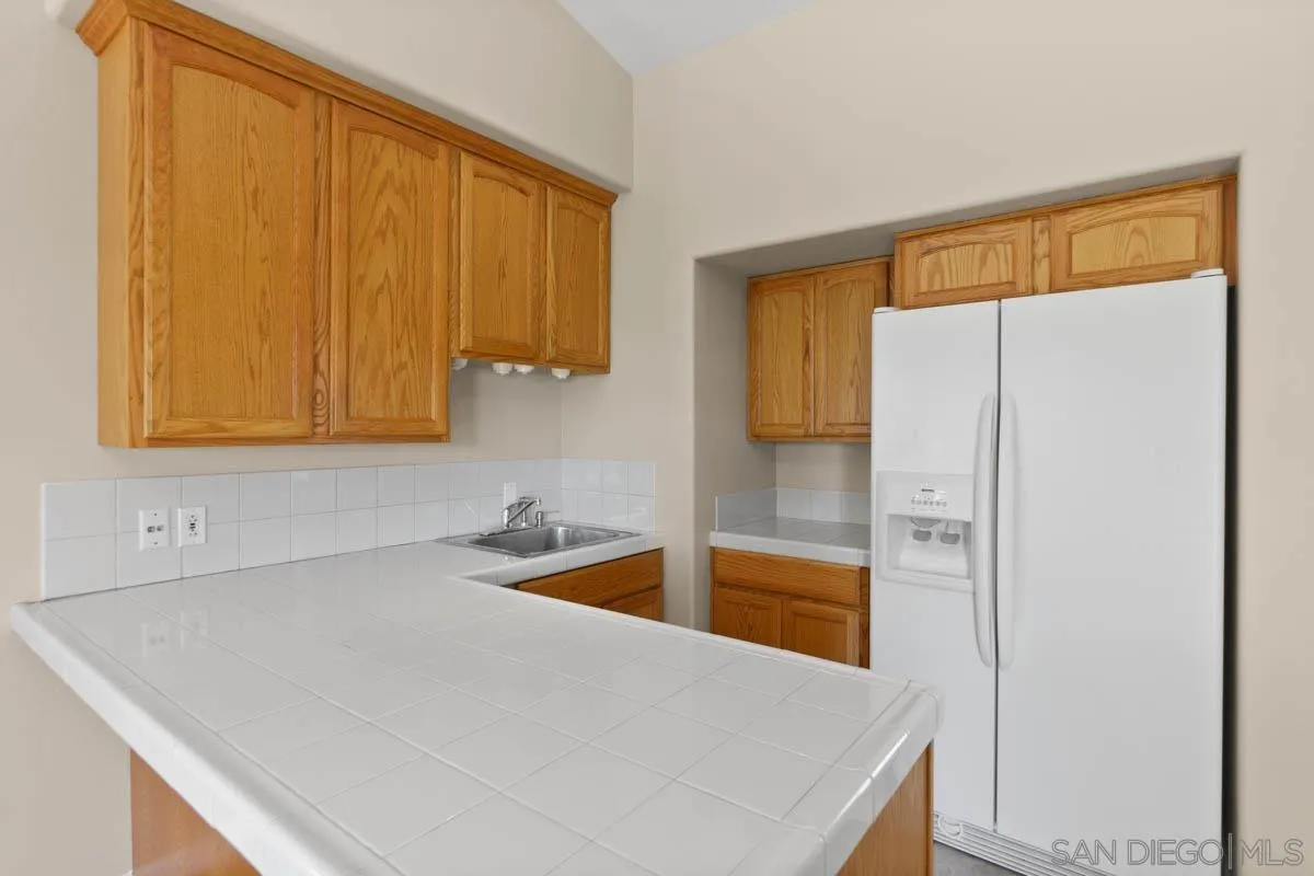 544 Alpine Trail Road Alpine, CA 91901 - Photo 43 of 52 a kitchen with a refrigerator and a sink