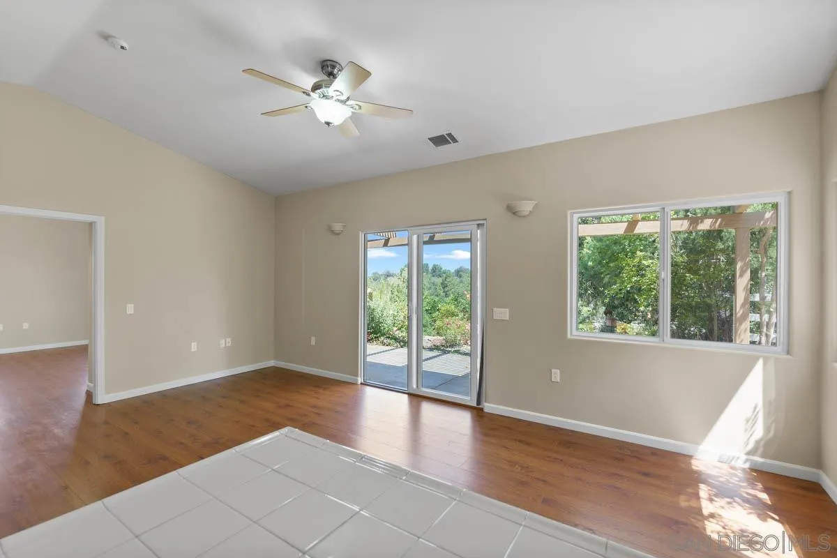 544 Alpine Trail Road Alpine, CA 91901 - Photo 44 of 52 a view of an empty room with wooden floor and a window