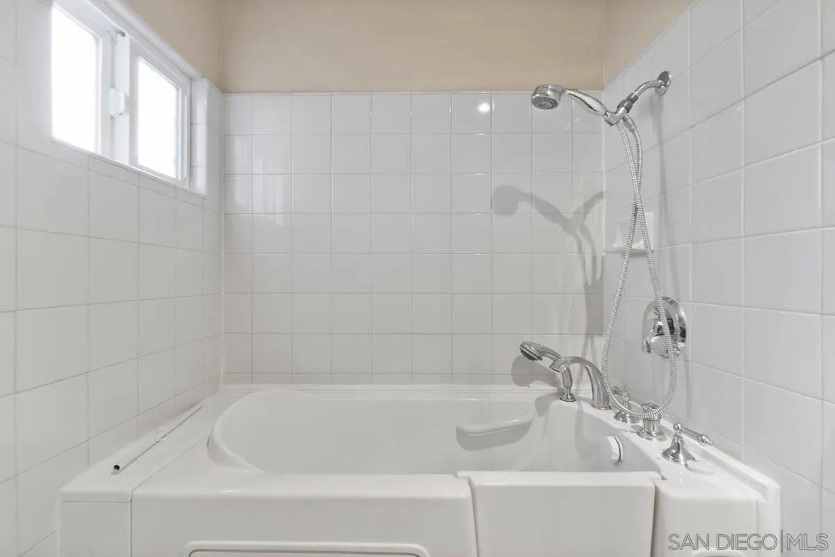 544 Alpine Trail Road Alpine, CA 91901 - Photo 48 of 52 a white bath tub sitting next to a white sink and vanity