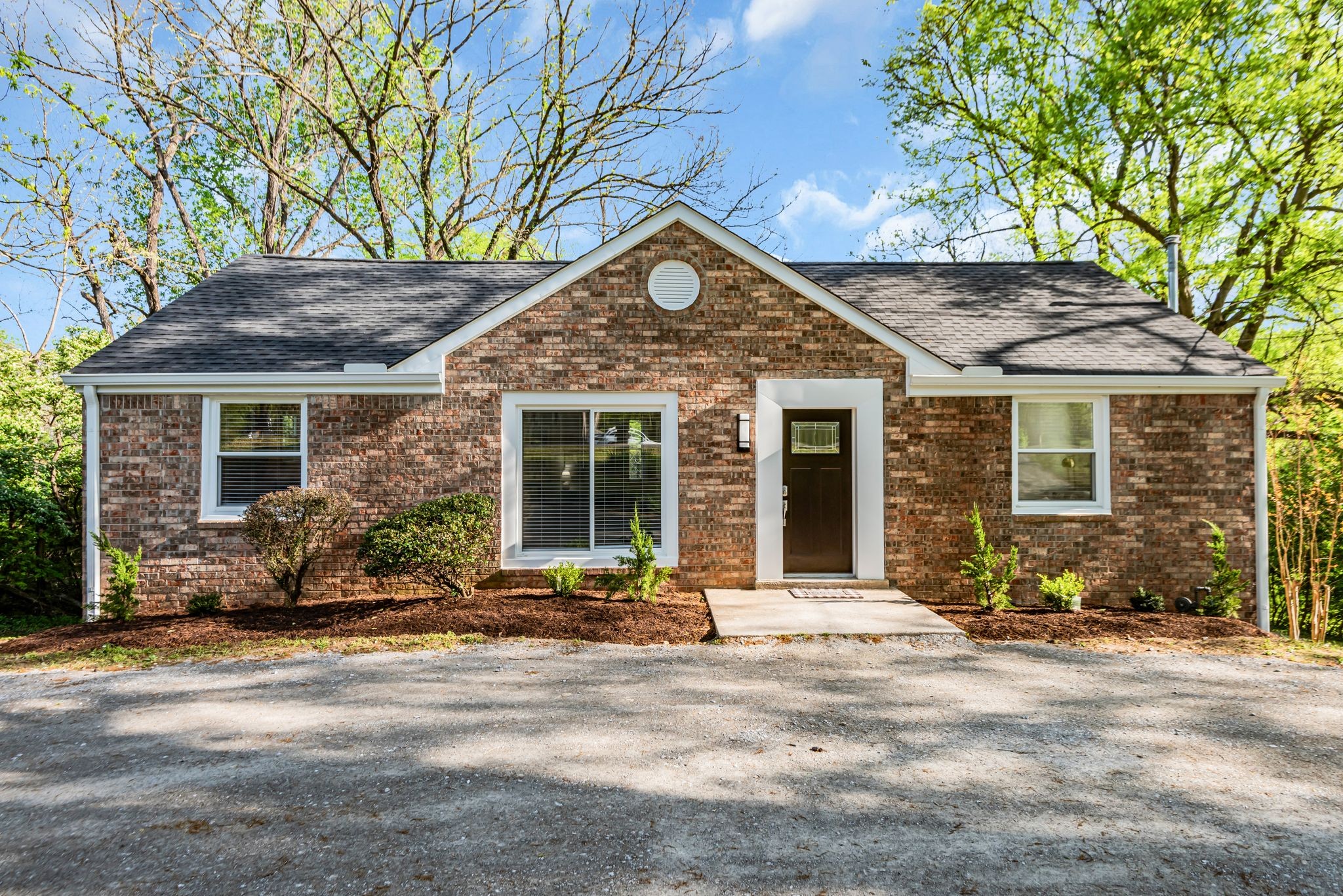 1234 Currey Road Nashville, TN 37217 - Photo 1 of 18 a front view of a house with a yard and outdoor seating
