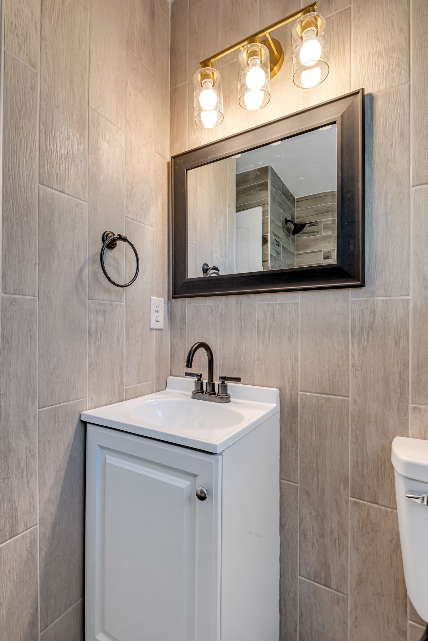 1234 Currey Road Nashville, TN 37217 - Photo 12 of 18 a bathroom with a sink a vanity and a mirror