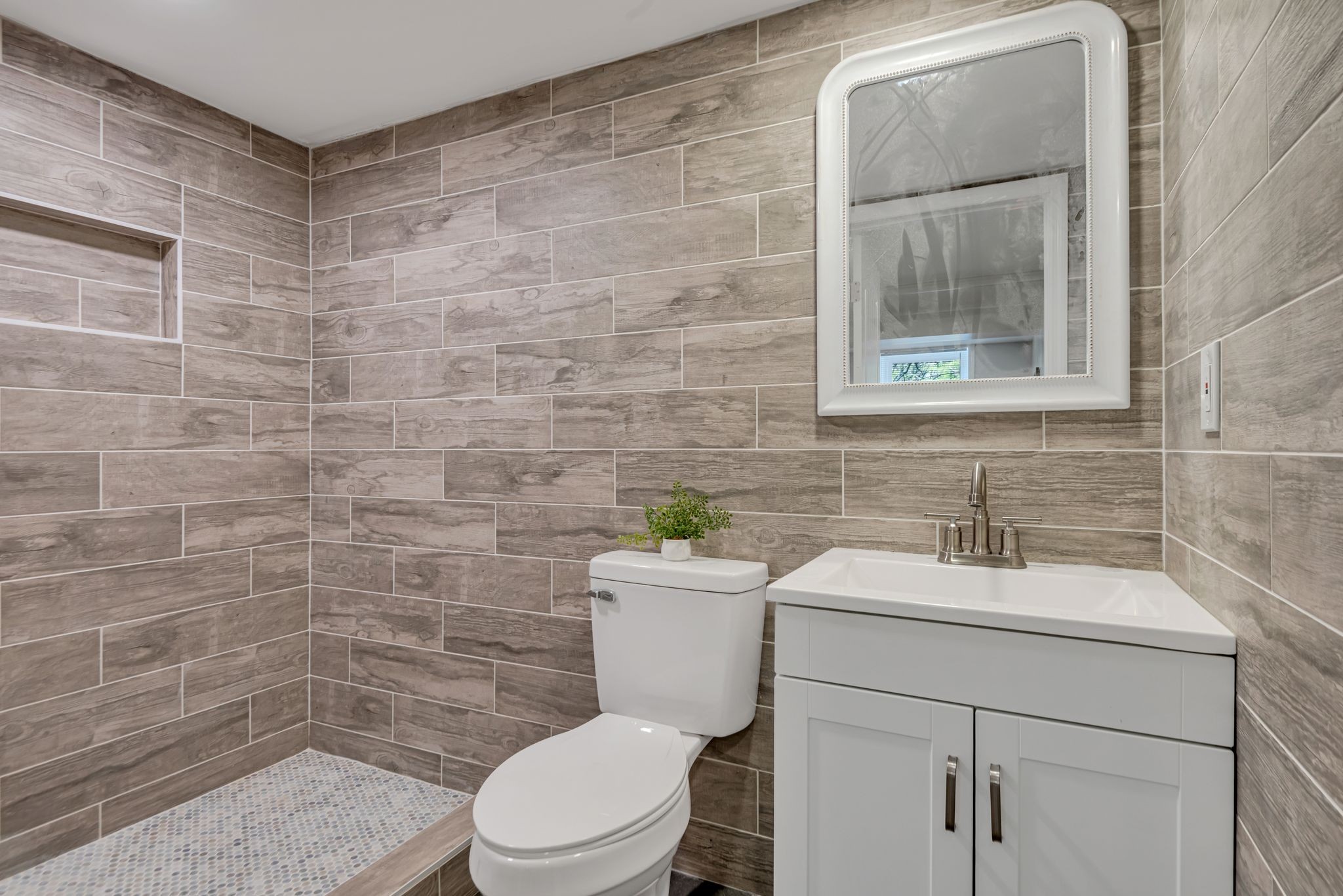1234 Currey Road Nashville, TN 37217 - Photo 13 of 18 a bathroom with a toilet sink and mirror