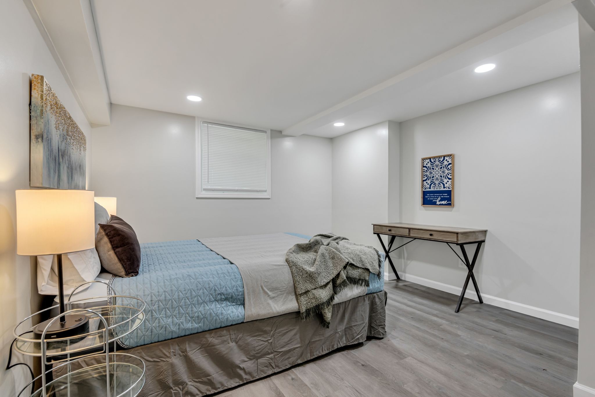 1234 Currey Road Nashville, TN 37217 - Photo 15 of 18 a bedroom with a bed and a lamp on table