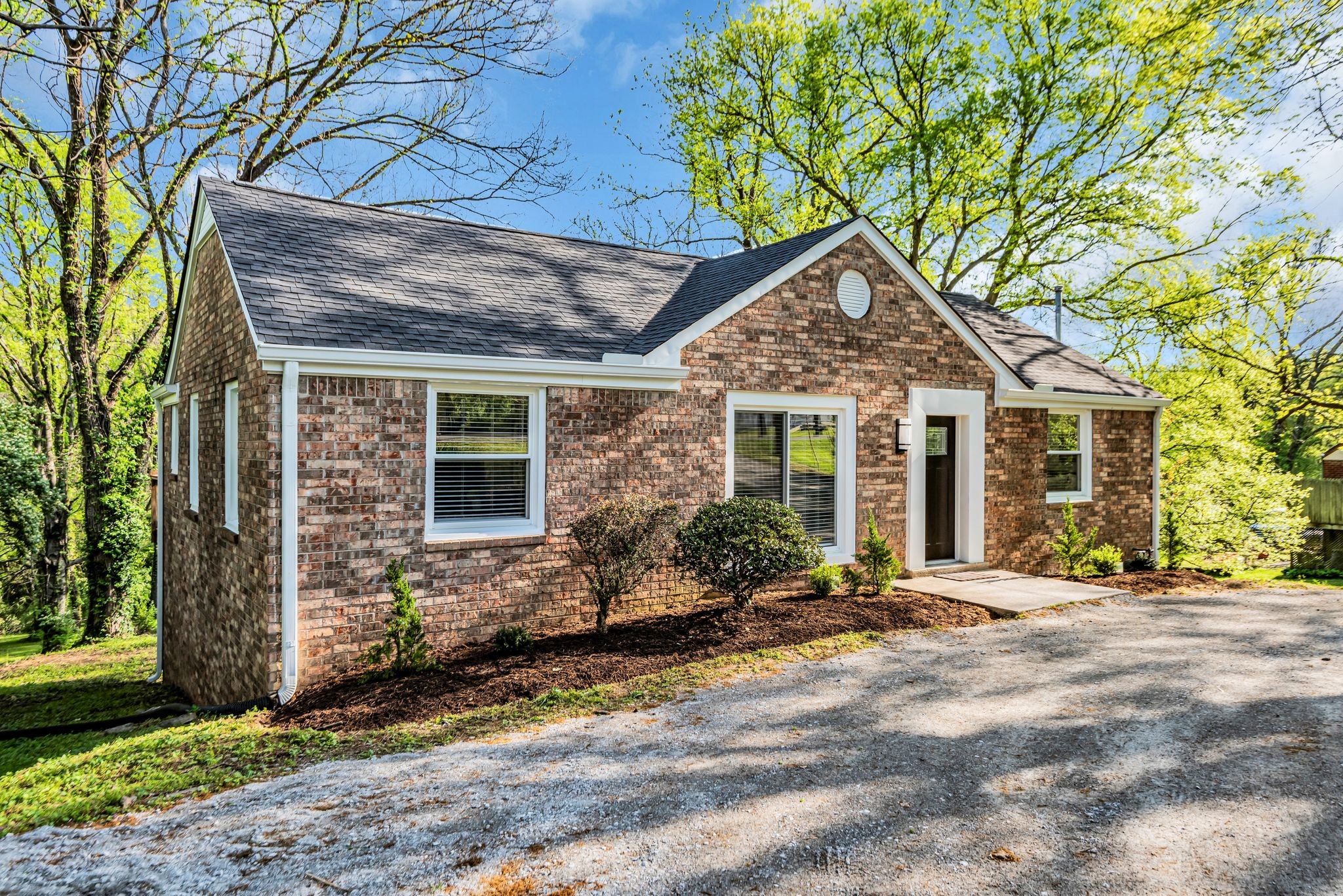 1234 Currey Road Nashville, TN 37217 - Photo 2 of 18 a front view of a house with a yard