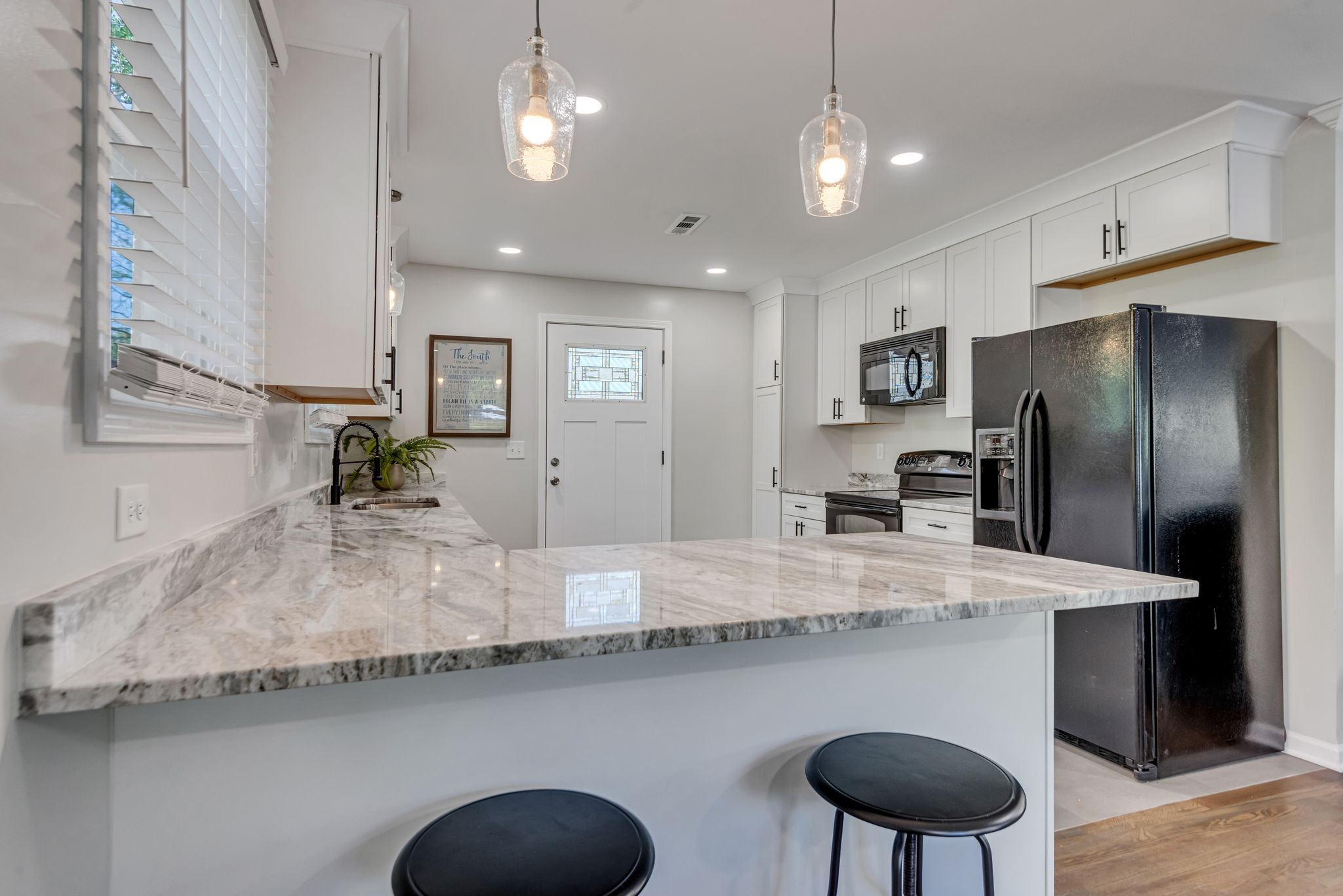 1234 Currey Road Nashville, TN 37217 - Photo 5 of 18 a kitchen with stainless steel appliances granite countertop a sink refrigerator and cabinets