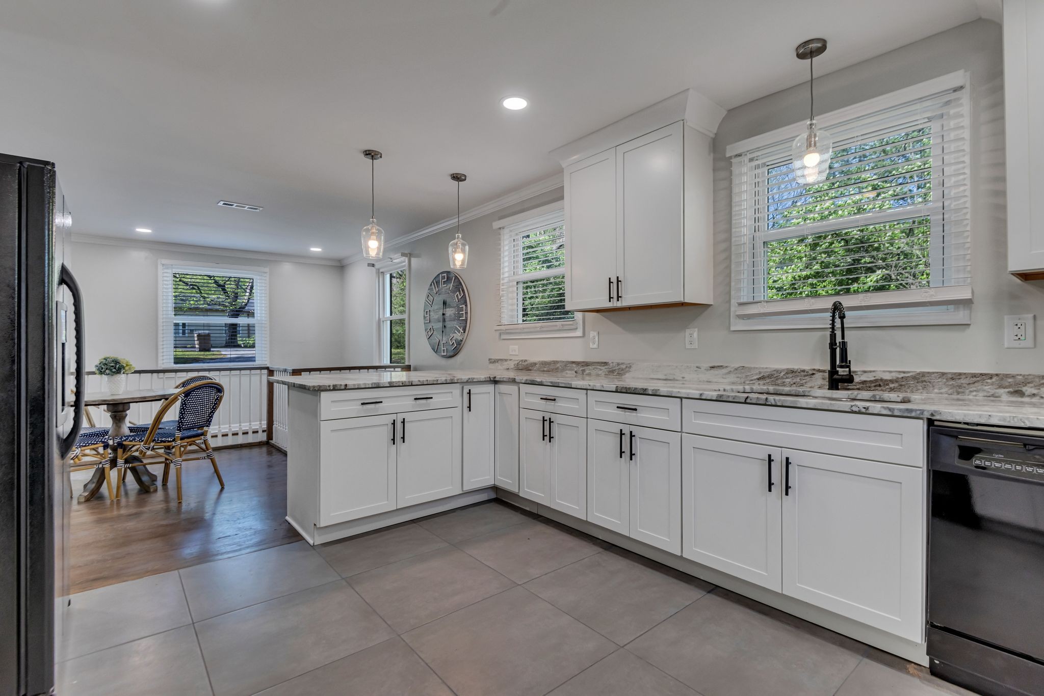1234 Currey Road Nashville, TN 37217 - Photo 6 of 18 a kitchen with granite countertop a sink cabinets and window