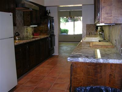 1230 Foothill Road Ojai, CA 93023 - Photo 5 of 7 a kitchen with a sink and a refrigerator